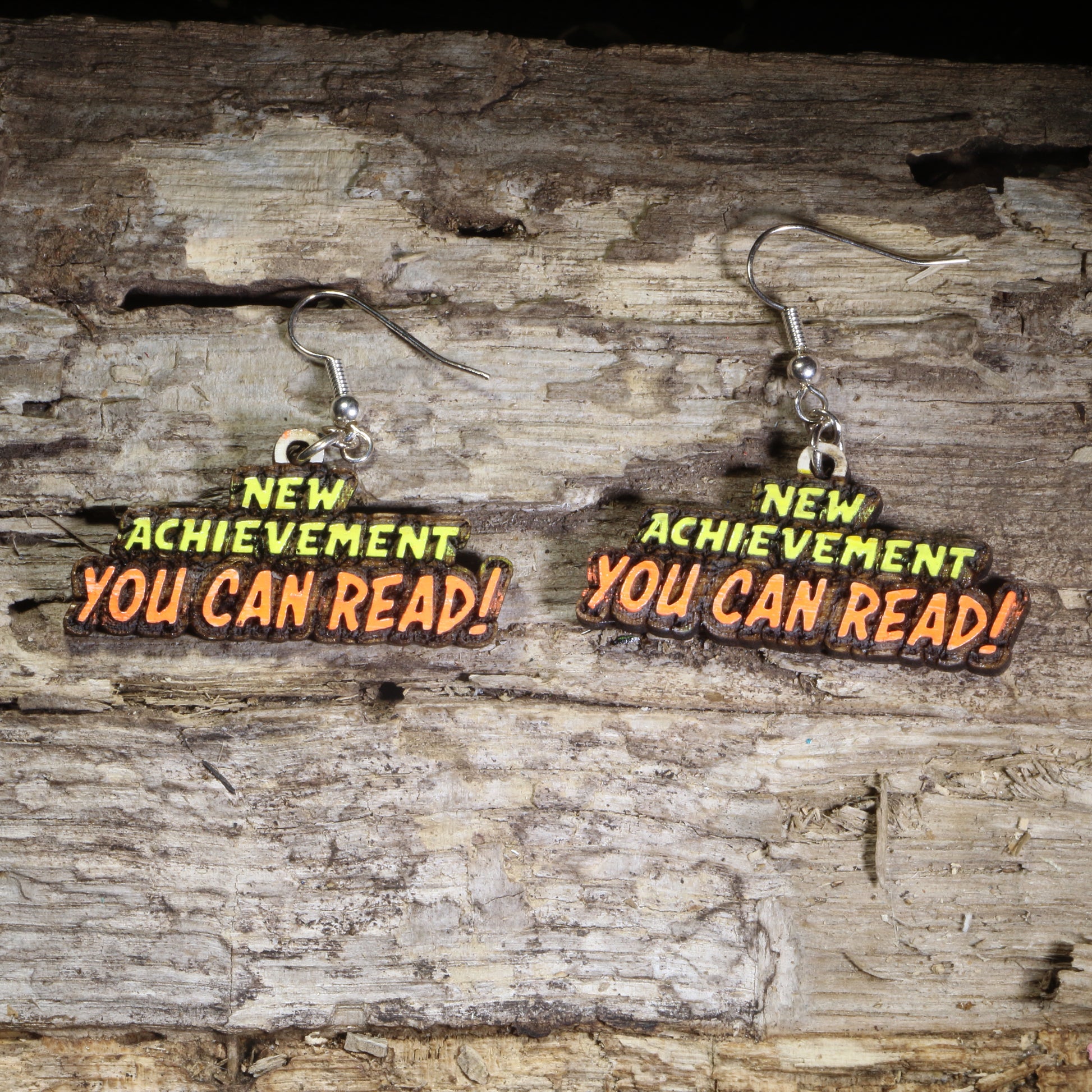 Handcrafted "You Can Read!" wooden dangle earrings featuring an encouraging reading message for educators and literacy advocates. Lightweight laser-cut wooden earrings with hypoallergenic .925 sterling silver hooks, perfect for teachers, reading specialists, librarians, literacy coaches, elementary educators, and book lovers.