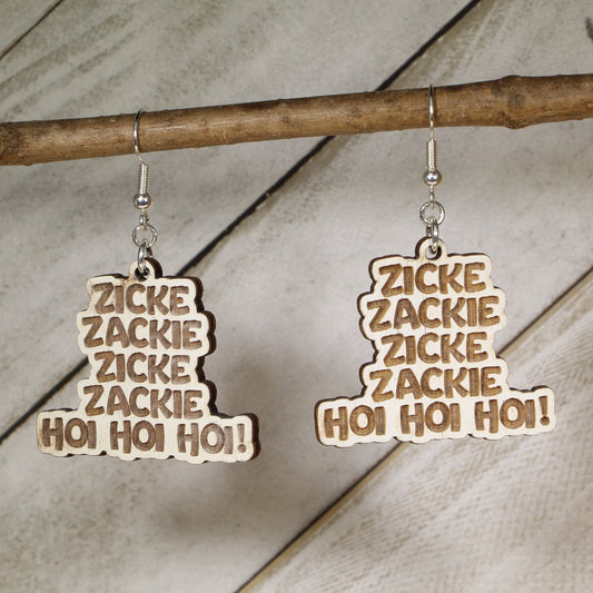 Hand-painted wooden “Zicke Zacke Hoi Hoi Hoi” dangle earrings with bold German chant lettering and hypoallergenic sterling silver hooks, lightweight Oktoberfest beer festival jewelry for German culture lovers and party celebrations