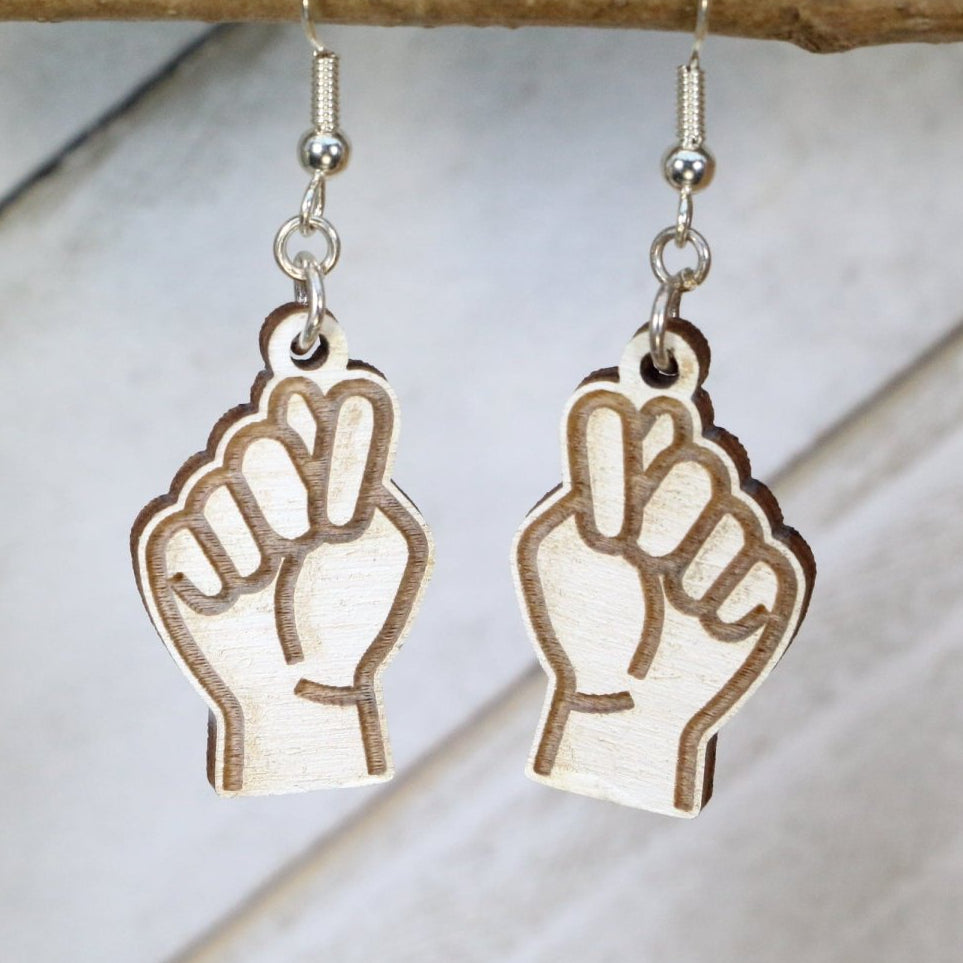 Hand-painted wooden ASL bathroom sign dangle earrings with American Sign Language design and hypoallergenic sterling silver hooks, deaf community statement jewelry for ASL users and sign language supporters