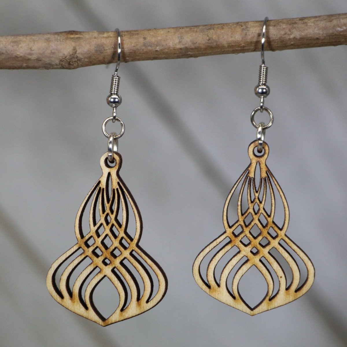 Hand-painted wooden Art Deco Gatsby twist dangle earrings featuring a refined geometric swirl design with symmetrical lines and hypoallergenic sterling silver hooks, lightweight jewelry for vintage lovers and 1920s-inspired fashion by Cate’s Concepts