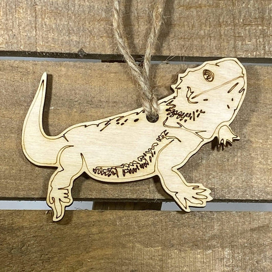 Hand-painted wooden bearded dragon Christmas ornament featuring a detailed reptile design with textured scales and spiky beard, unique holiday decor for reptile lovers and exotic pet enthusiasts by Cate’s Concepts
