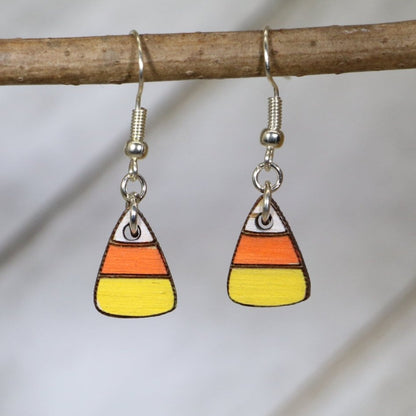 Hand-painted wooden candy corn dangle earrings with sweet Halloween treat design and hypoallergenic sterling silver hooks, lightweight candy statement jewelry earrings for spooky season and festive fall style