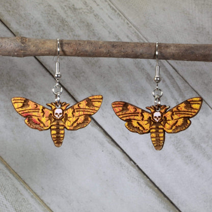 Hand-painted wooden death head hawkmoth dangle earrings with gothic insect skull design and hypoallergenic sterling silver hooks, lightweight hawkmoth statement jewelry earrings for dark aesthetic style