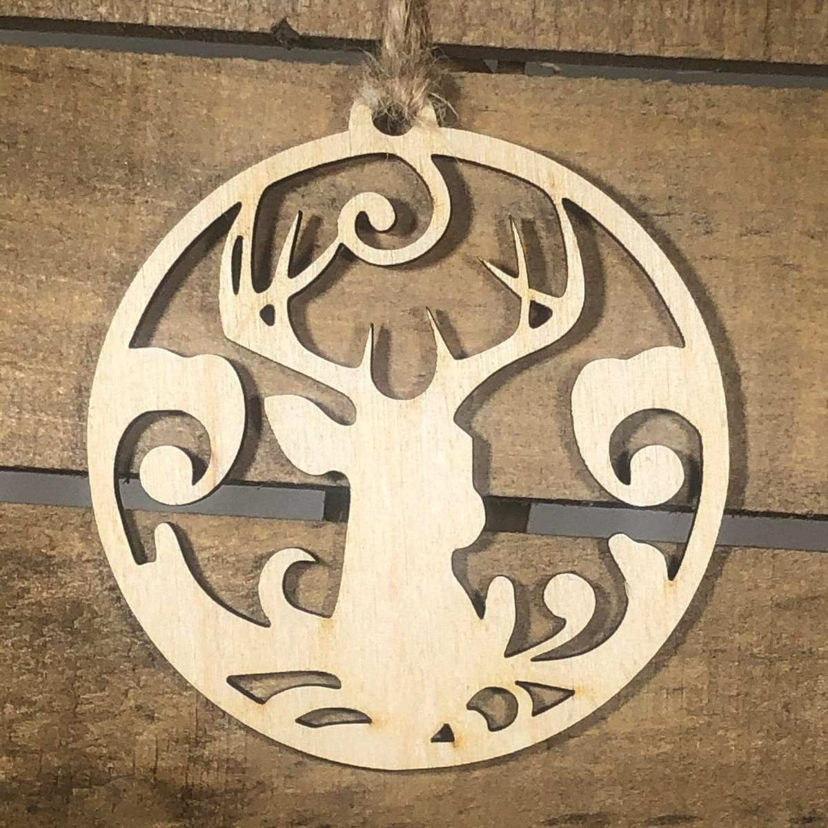 Hand-painted wooden deer Christmas ornament featuring a rustic woodland design with detailed antlers and natural silhouette, cozy holiday decor for cabin lovers and nature enthusiasts by Cate’s Concepts