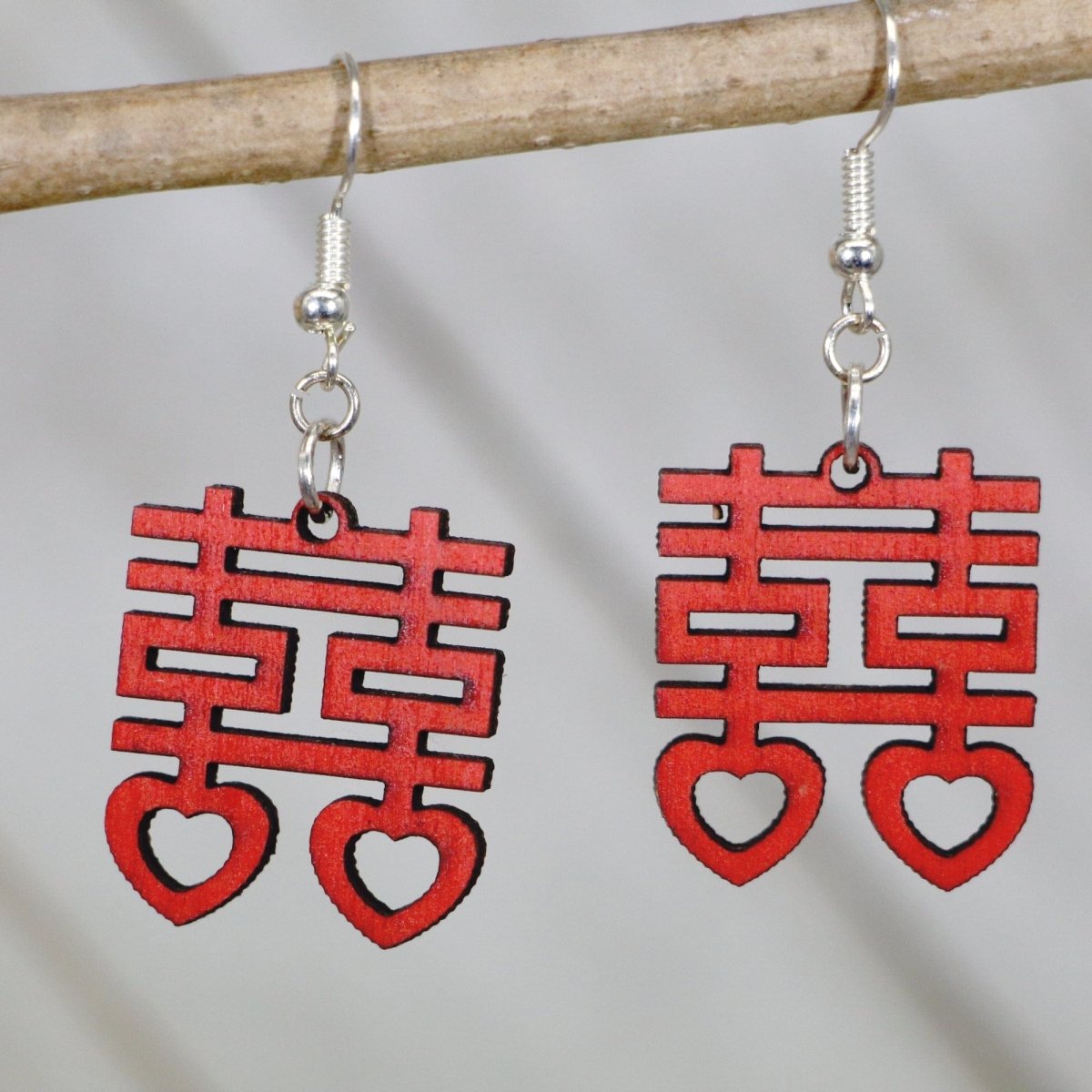 Celebrate love, joy, and good fortune with these Double Happiness Heart Wooden Earrings—hand-painted, lightweight, and perfect for weddings, anniversaries, and meaningful romantic style.