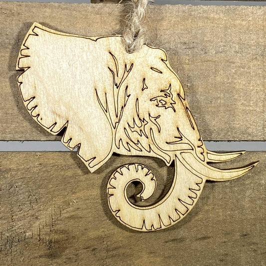 Hand-painted wooden elephant profile Christmas ornament featuring a detailed safari animal silhouette with curved trunk and tusk design, unique holiday decor for wildlife lovers and animal enthusiasts by Cate’s Concepts