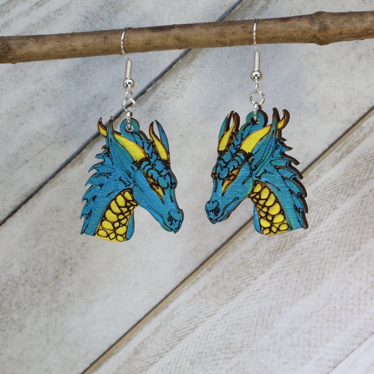 Blue Hand-painted wooden fantasy dragon dangle earrings with detailed mythical creature design and hypoallergenic sterling silver hooks, lightweight dragon statement jewelry earrings for fantasy lovers and magical style