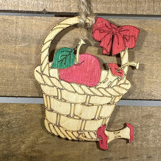 Hand-painted wooden farmhouse apple Christmas ornament featuring a rustic red apple design with natural detailing and country charm, cozy holiday decor for farmhouse kitchens and rustic home lovers by Cate’s Concepts