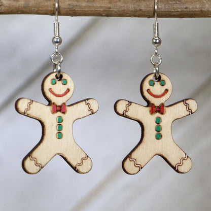 Hand-painted wooden gingerbread man dangle earrings with festive Christmas cookie design and hypoallergenic sterling silver hooks, lightweight holiday statement jewelry earrings for winter style
