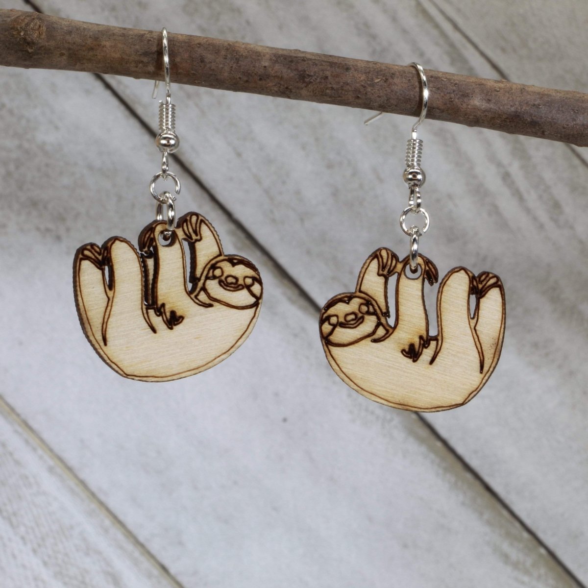 Hand-painted wooden hanging sloth dangle earrings with cute jungle animal design and hypoallergenic sterling silver hooks, lightweight sloth statement jewelry earrings for animal lovers 