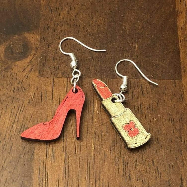Hand-painted wooden high heel and lipstick dangle earrings featuring a stylish fashion design with detailed stiletto and lipstick accents and hypoallergenic sterling silver hooks, lightweight jewelry for beauty lovers and glam fashion enthusiasts by Cate’s Concepts