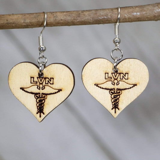 Hand-painted wooden LVN nurse dangle earrings featuring bold licensed vocational nurse lettering with clean medical-inspired design and hypoallergenic sterling silver hooks, lightweight jewelry for healthcare workers and nurse appreciation gifts by Cate’s Concepts
