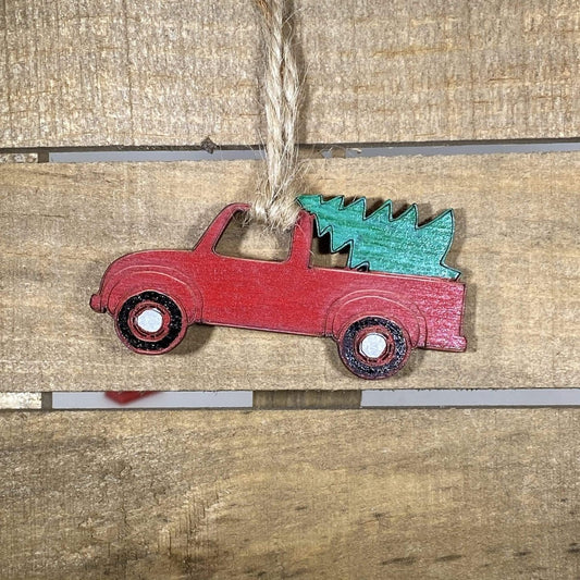 Hand-painted wooden little red truck Christmas ornament featuring a vintage pickup carrying holiday charm with classic rustic detailing, festive decor for farmhouse lovers and nostalgic Christmas enthusiasts by Cate’s Concepts