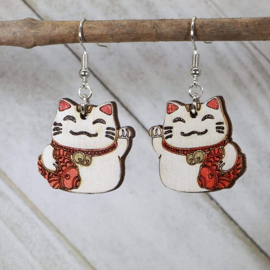 Hand-painted wooden lucky cat Maneki Neko dangle earrings with Japanese good luck design and hypoallergenic sterling silver hooks, lightweight lucky cat statement jewelry earrings for prosperity and kawaii style