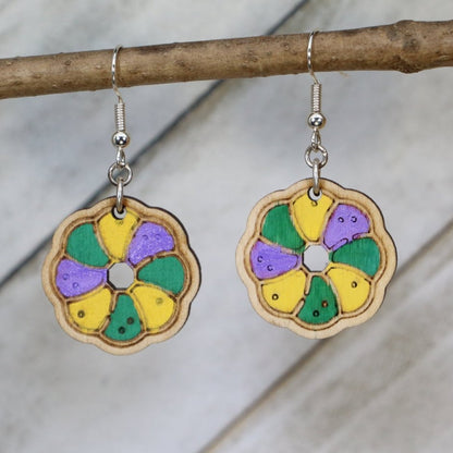 Hand-painted wooden Mardi Gras king cake dangle earrings with festive Louisiana dessert design and hypoallergenic sterling silver hooks, lightweight king cake statement jewelry earrings for New Orleans carnival style