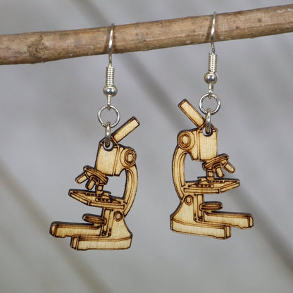 Hand-painted wooden microscope dangle earrings with detailed science lab design and hypoallergenic sterling silver hooks, lightweight STEM statement jewelry earrings for teachers, scientists, and biology lovers