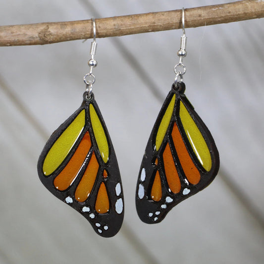 Hand-painted wood and resin monarch butterfly wing dangle earrings with vibrant orange and black design and hypoallergenic sterling silver hooks, lightweight butterfly statement jewelry earrings for nature lovers
