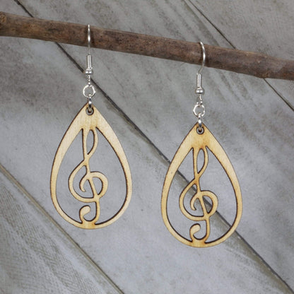 Hand-painted wooden music heart earrings featuring a treble clef heart design with detailed musical lines and hypoallergenic sterling silver hooks, lightweight jewelry for music lovers and band enthusiasts by Cate’s Concepts