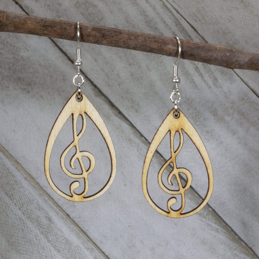 Hand-painted wooden music heart earrings featuring a treble clef heart design with detailed musical lines and hypoallergenic sterling silver hooks, lightweight jewelry for music lovers and band enthusiasts by Cate’s Concepts