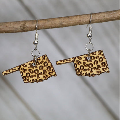 Hand-painted wooden Oklahoma state cheetah print dangle earrings with bold animal print design and hypoallergenic sterling silver hooks, lightweight Oklahoma statement jewelry earrings for southern style and state pride 