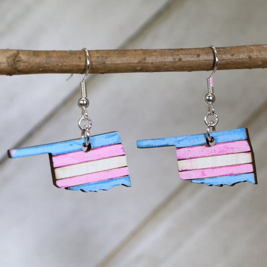 Hand-painted wooden Oklahoma trans pride dangle earrings with transgender pride color state design and hypoallergenic sterling silver hooks, lightweight LGBTQ statement jewelry earrings for Oklahoma pride and inclusive everyday style