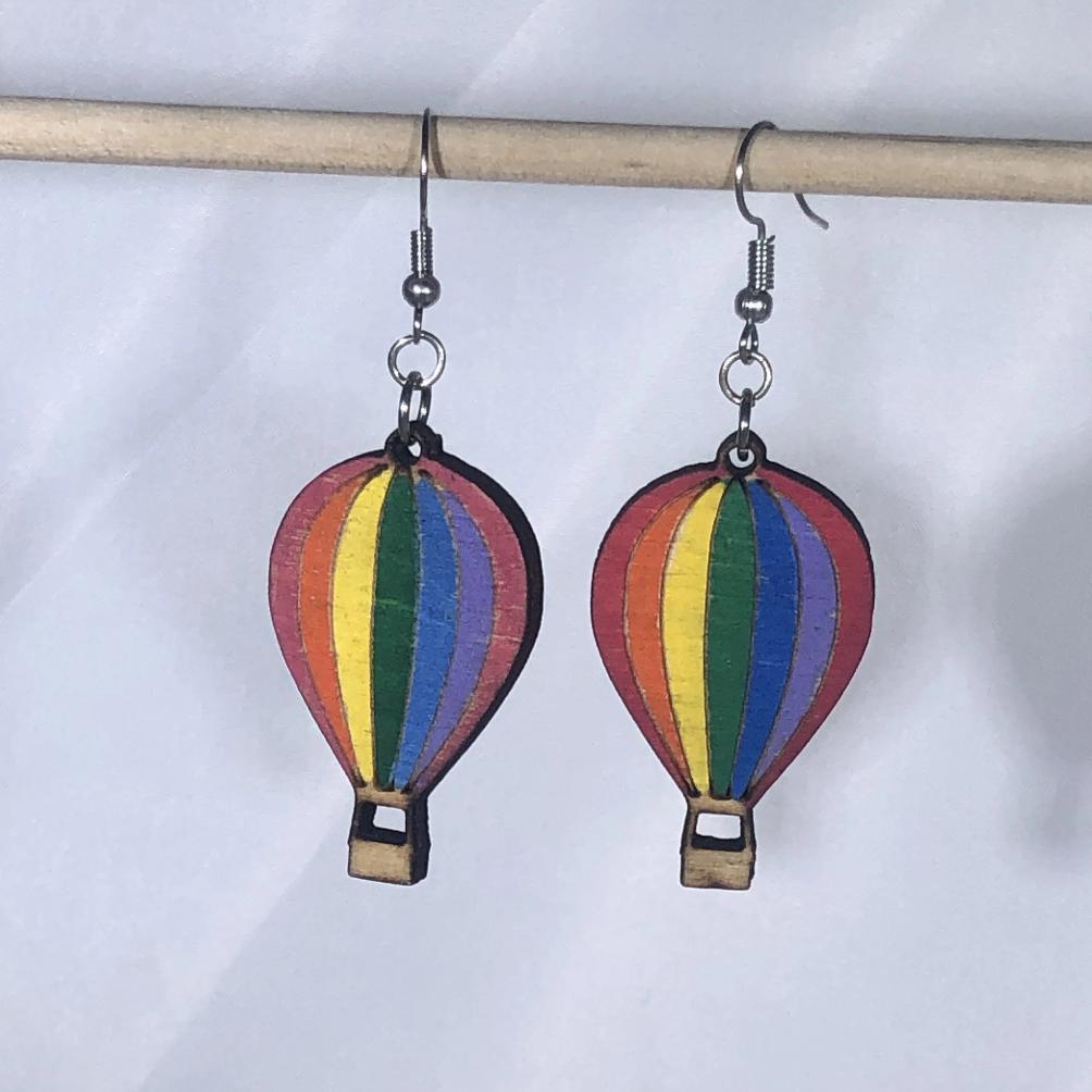 Hand-painted wooden rainbow hot air balloon dangle earrings with colorful travel design and hypoallergenic sterling silver hooks, lightweight balloon statement jewelry earrings for adventure lovers and wanderlust style