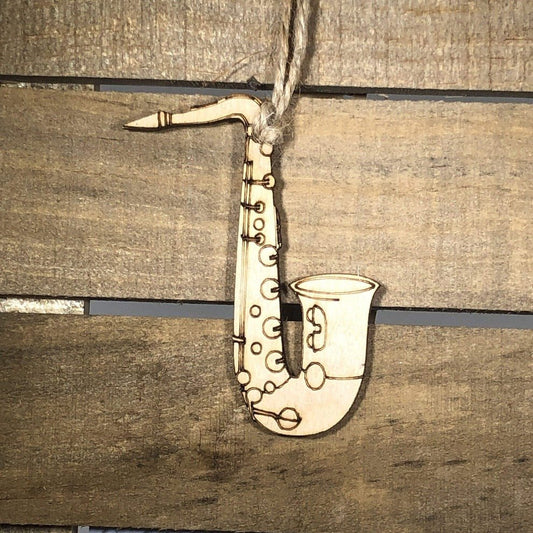 Hand-painted wooden saxophone Christmas ornament featuring a detailed curved instrument design with keys and bell, festive holiday decor for band members and music lovers by Cate’s Concepts