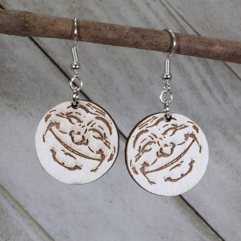 Hand-painted wooden smiling moon dangle earrings featuring a crescent moon with a cheerful face and celestial detailing and hypoallergenic sterling silver hooks, lightweight jewelry for stargazers and whimsical night sky lovers by Cate’s Concepts