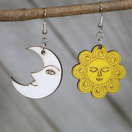 Hand-painted wooden sun and moon dangle earrings with celestial smiley face design and hypoallergenic sterling silver hooks, lightweight cosmic statement jewelry earrings for boho mystical and playful style