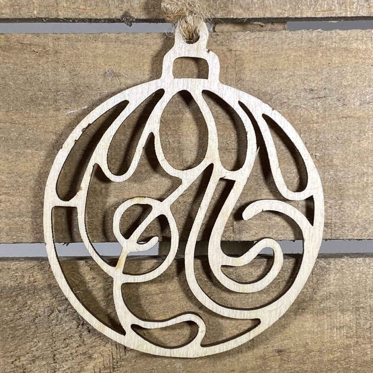 Hand-painted wooden swirl Christmas ornament featuring an elegant flowing spiral design with smooth curves and refined detailing, sophisticated holiday decor for modern homes and minimalist tree styling by Cate’s Concepts
