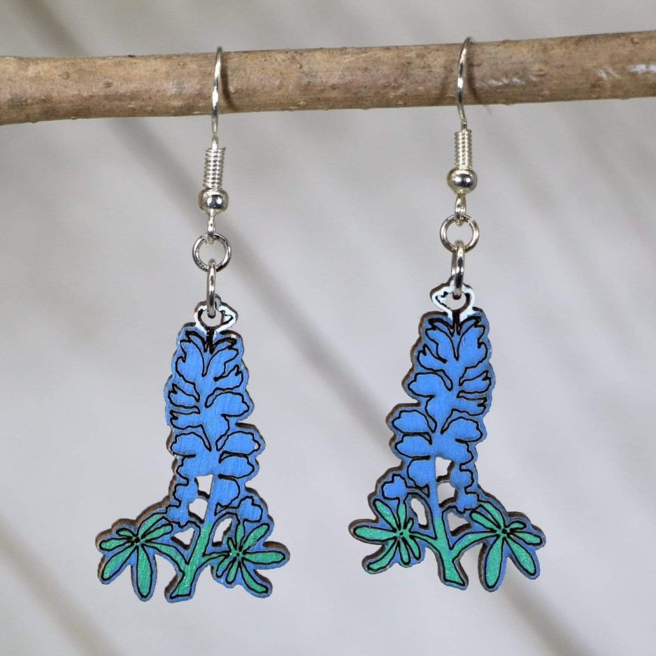 Hand-painted wooden Texas bluebonnet dangle earrings with detailed state flower design and hypoallergenic sterling silver hooks, lightweight bluebonnet statement jewelry earrings for Texas pride and wildflower style