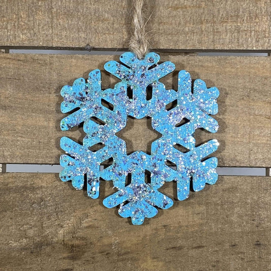 Hand-painted wooden winter snowflake Christmas ornament featuring an intricate symmetrical snowflake design with delicate cutout details, elegant holiday decor for winter lovers and festive seasonal displays by Cate’s Concepts