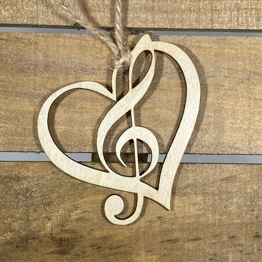 Hand-painted wooden heart treble clef Christmas ornament featuring a musical note shaped into a heart design with elegant curves, festive holiday decor for musicians and music lovers by Cate’s Concepts
